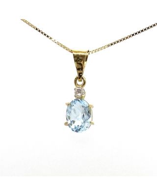 Ciondolo in oro giallo, topazio azzurro e zircone 