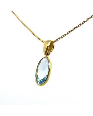 Ciondolo in oro giallo e topazio azzurro