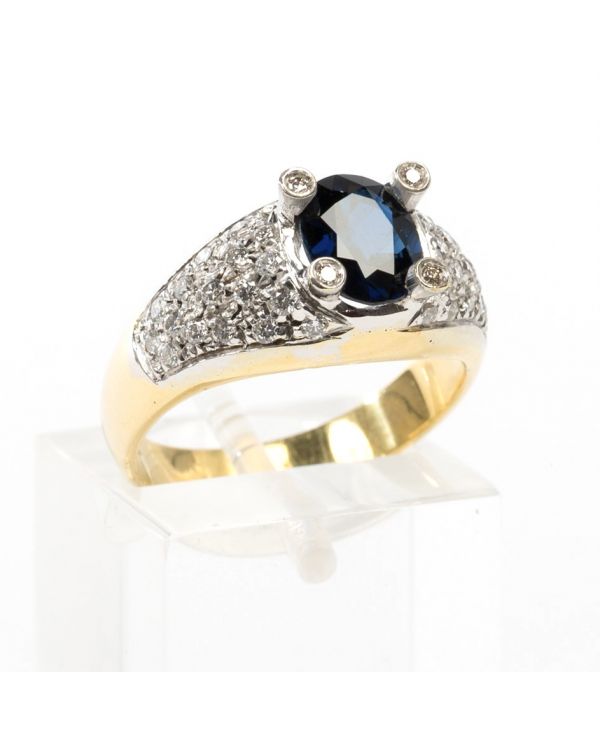 Anello in oro con diamanti e zaffiro blu